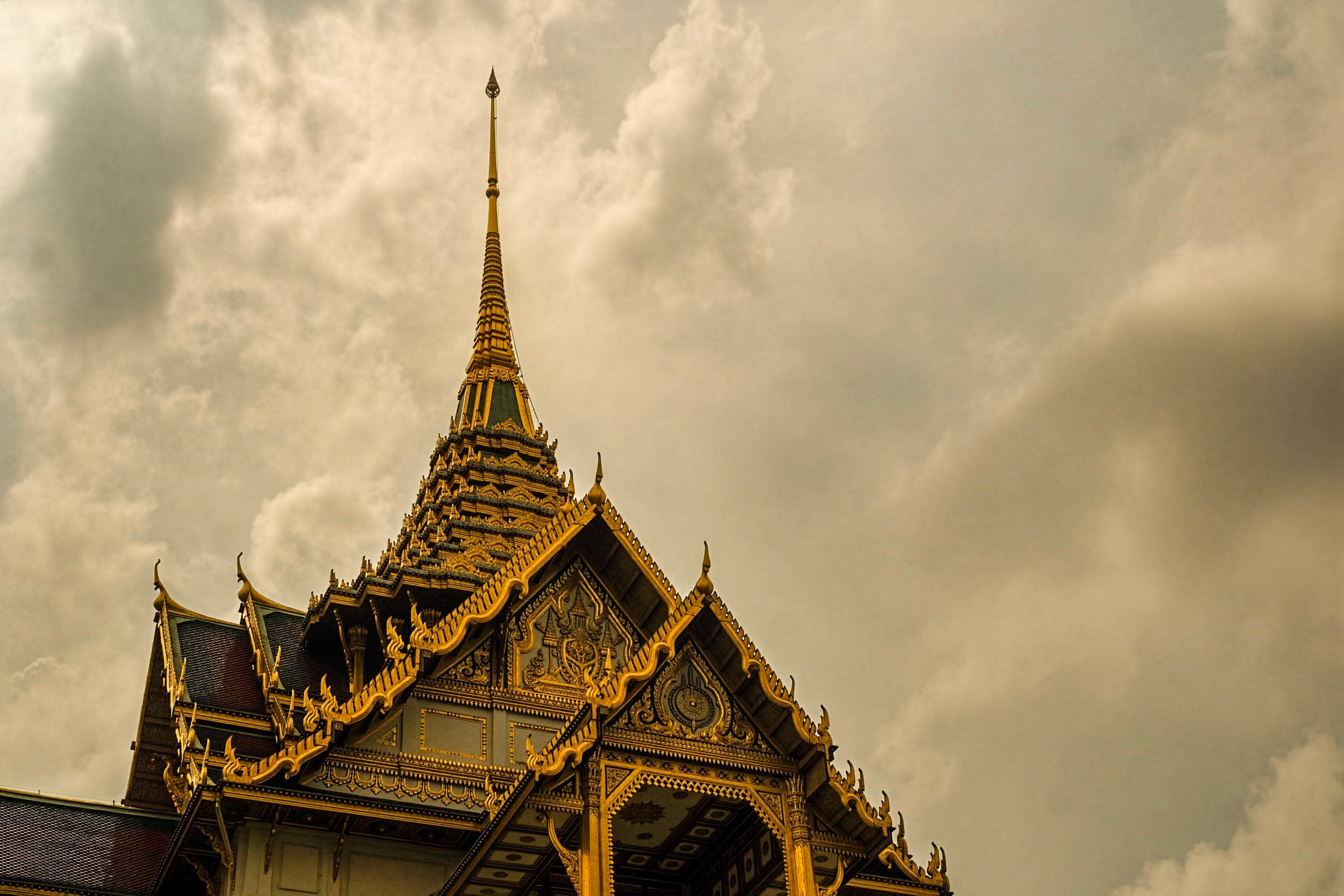 Thai Temple Storm Clouds Photo - Golden Spire Architecture